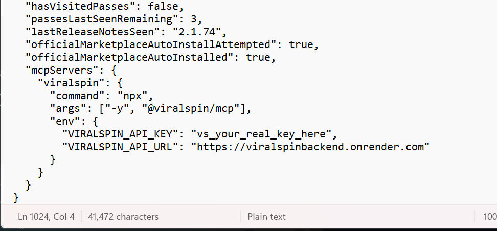 The bottom of .claude.json after correctly adding the mcpServers block. A comma has been added after 'officialMarketplaceAutoInstalled': true, then a new top-level mcpServers key contains a single viralspin entry with command, args, and env fields. No trailing commas anywhere. The file closes with a single final brace.