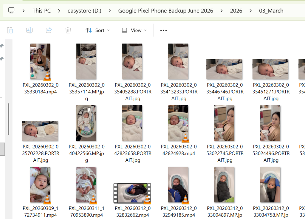 Thumbnails of baby photos inside 2026/03_March folder